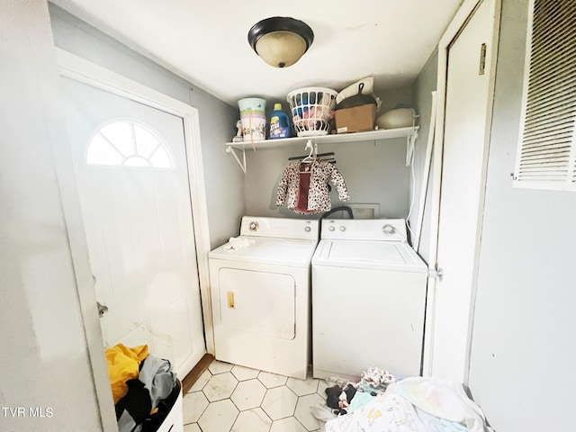 laundry room with washing machine and clothes dryer