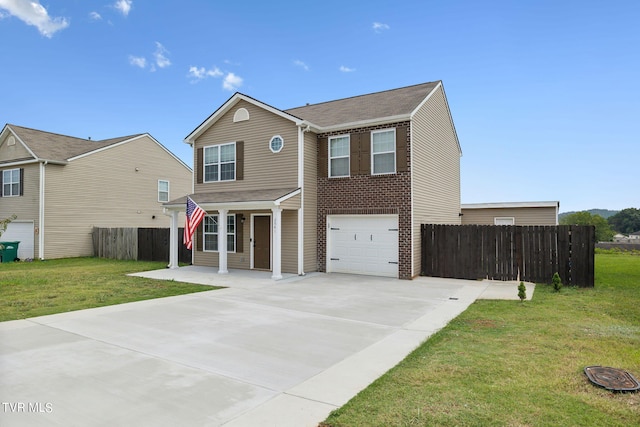 view of front of home with a front lawn and a garage