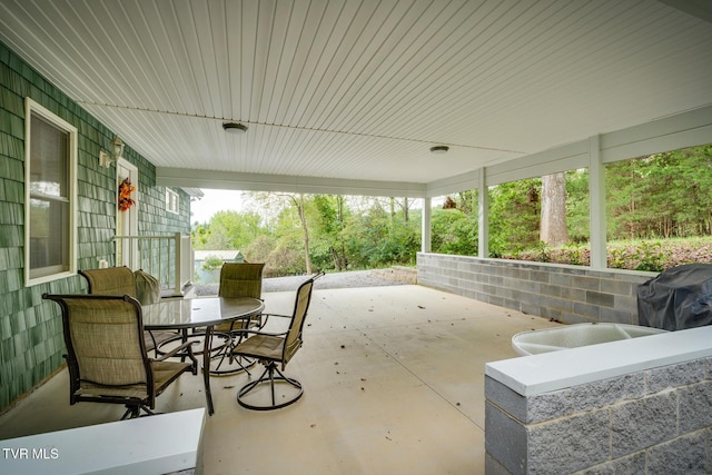 view of patio / terrace featuring outdoor dining area and grilling area