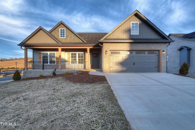 view of front of house with a garage and covered porch