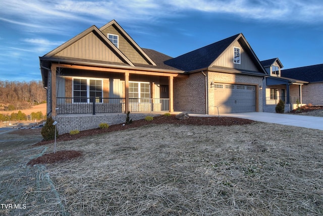 view of front facade featuring a garage and covered porch