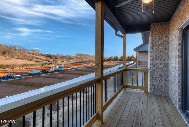 wooden deck featuring a rural view