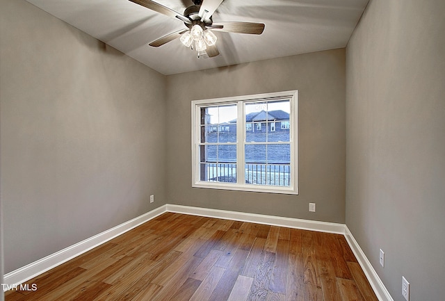 unfurnished room featuring hardwood / wood-style flooring and ceiling fan