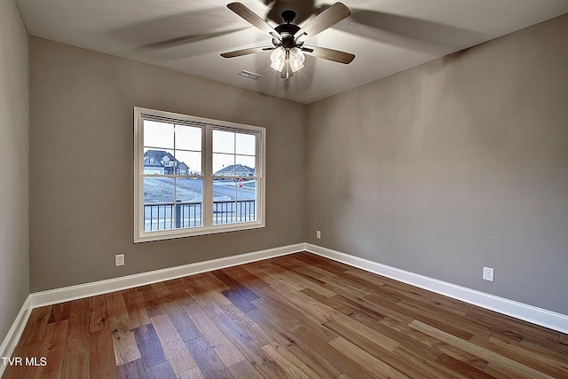 unfurnished room featuring hardwood / wood-style flooring and ceiling fan