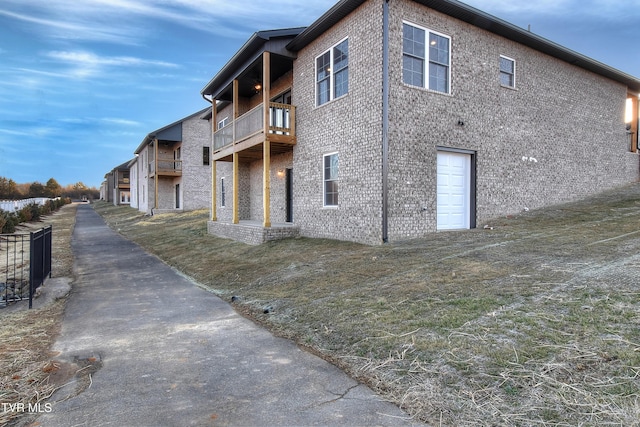 view of side of home with a balcony