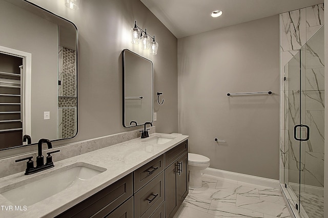 bathroom featuring vanity, an enclosed shower, and toilet