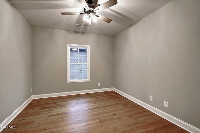 spare room with ceiling fan and light hardwood / wood-style flooring