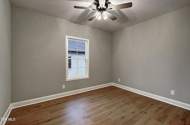 empty room featuring ceiling fan and light wood-type flooring