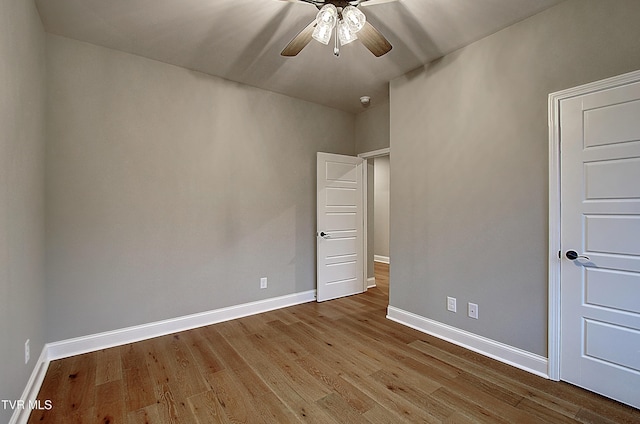 unfurnished bedroom featuring ceiling fan and light hardwood / wood-style flooring