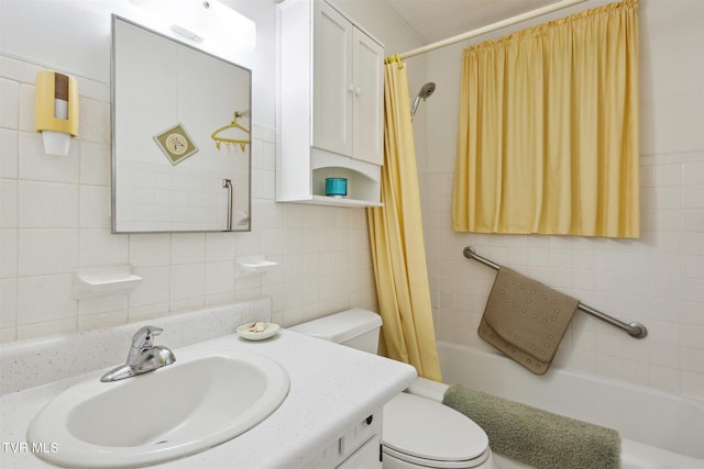 full bathroom featuring shower / bath combination with curtain, vanity, tile walls, and toilet