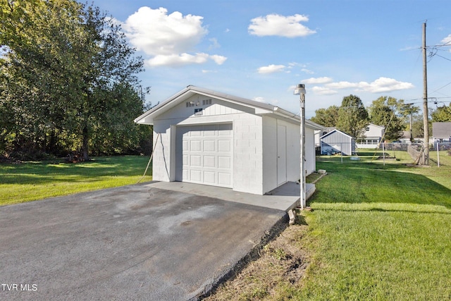 garage with a lawn