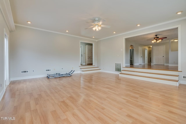 interior space featuring ornamental molding, ceiling fan, and light hardwood / wood-style flooring