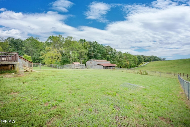 view of yard with a rural view