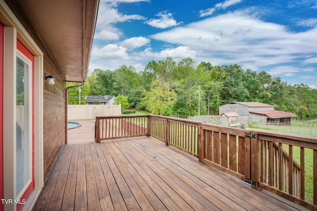 deck featuring a shed