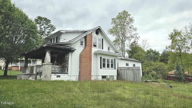 view of home's exterior with a lawn