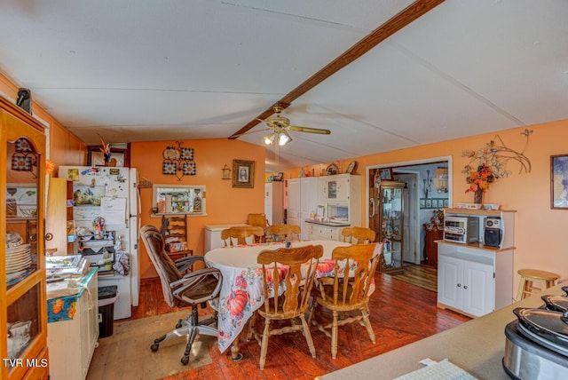 dining room with vaulted ceiling with beams, ceiling fan, and light wood finished floors