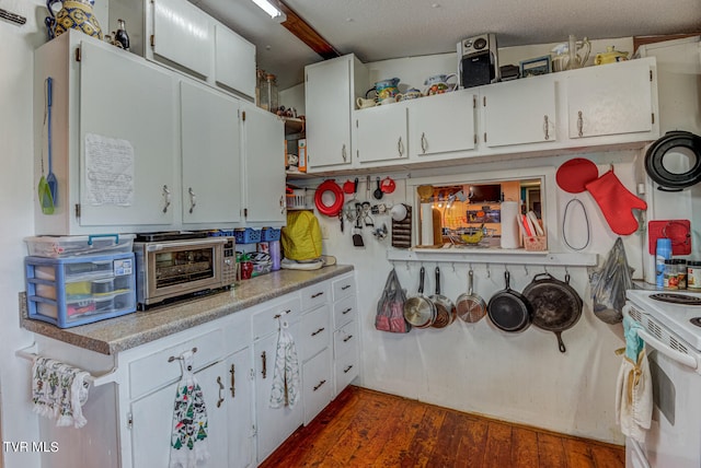 kitchen with white cabinetry, a textured ceiling, dark wood-type flooring, and white electric range