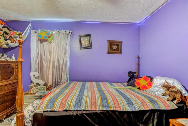 bedroom featuring a textured ceiling