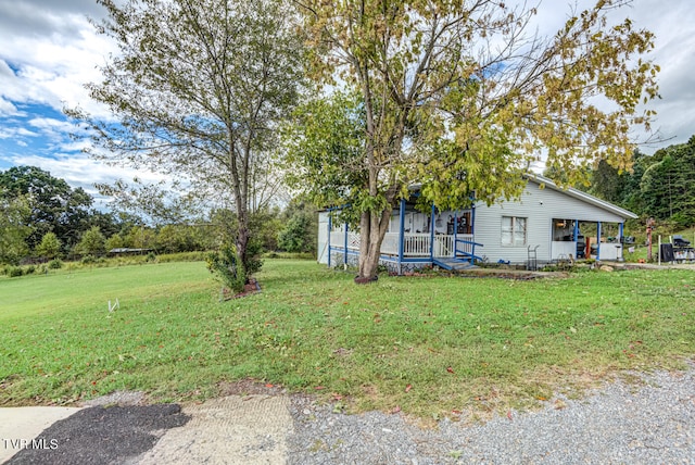 view of front of house with a front lawn and covered porch