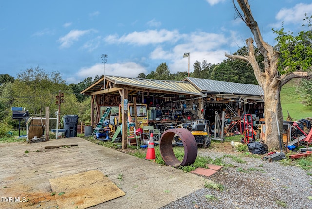 view of playground with an outbuilding