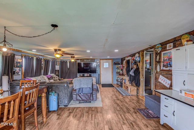 living area featuring wood finished floors, recessed lighting, and a ceiling fan