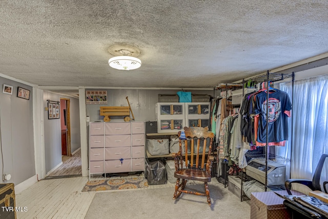 interior space featuring a textured ceiling and light wood-type flooring