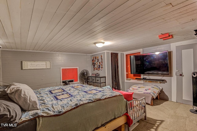 carpeted bedroom with wood ceiling