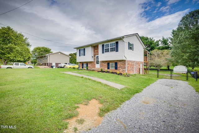 raised ranch with a front lawn