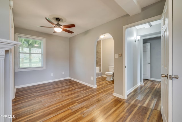 unfurnished room with wood-type flooring and ceiling fan