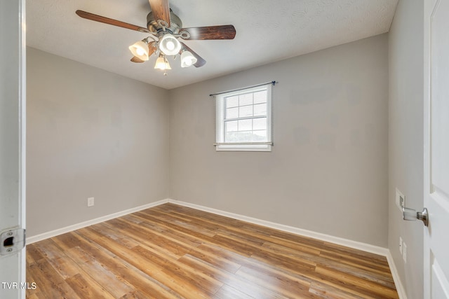 spare room featuring ceiling fan, a textured ceiling, and light hardwood / wood-style flooring