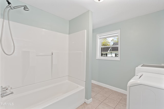 bathroom with tile patterned flooring and shower / bath combination