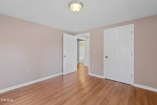 unfurnished bedroom featuring light hardwood / wood-style floors