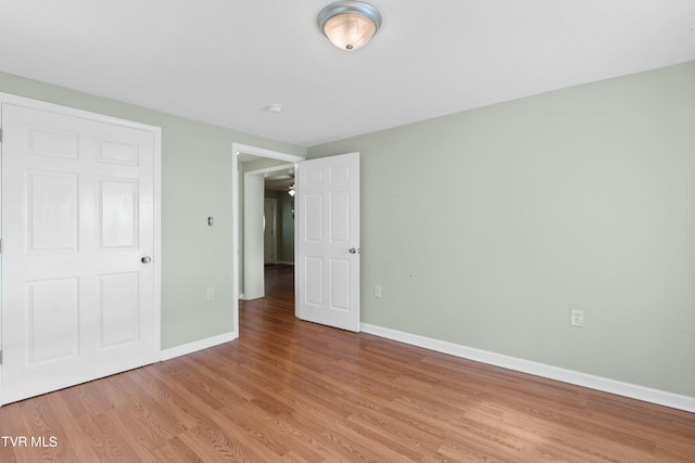 unfurnished bedroom featuring light hardwood / wood-style floors