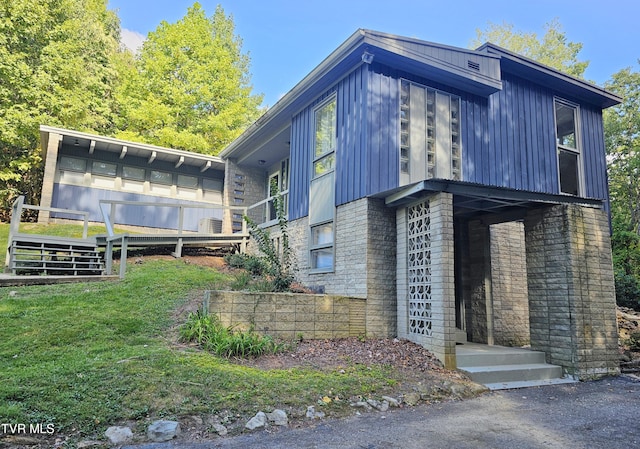 view of property exterior featuring a lawn