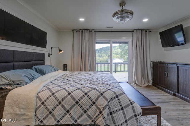 bedroom featuring access to exterior, crown molding, and light hardwood / wood-style floors