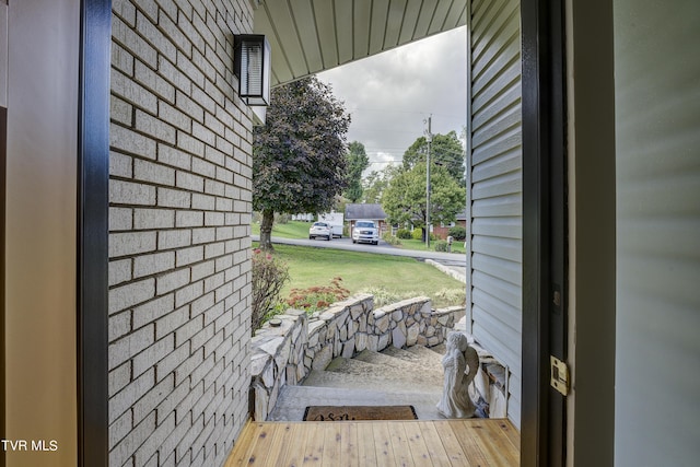 exterior space featuring brick wall