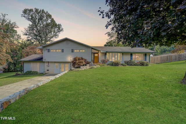 view of front of house with a yard