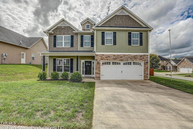 view of front of home featuring a garage and a front yard