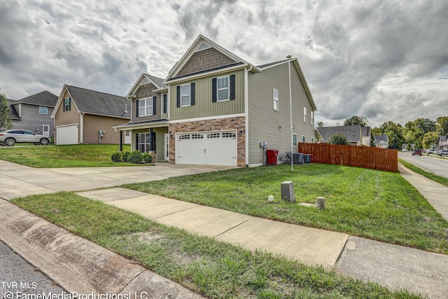 view of front of property featuring a front yard and a garage