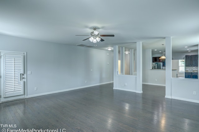 unfurnished living room featuring ceiling fan and dark wood-type flooring