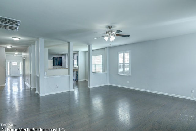 unfurnished room featuring dark hardwood / wood-style flooring and ceiling fan