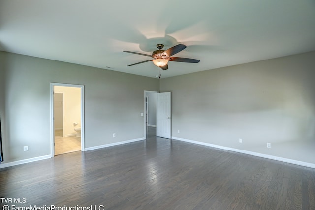 unfurnished room with ceiling fan and dark hardwood / wood-style flooring