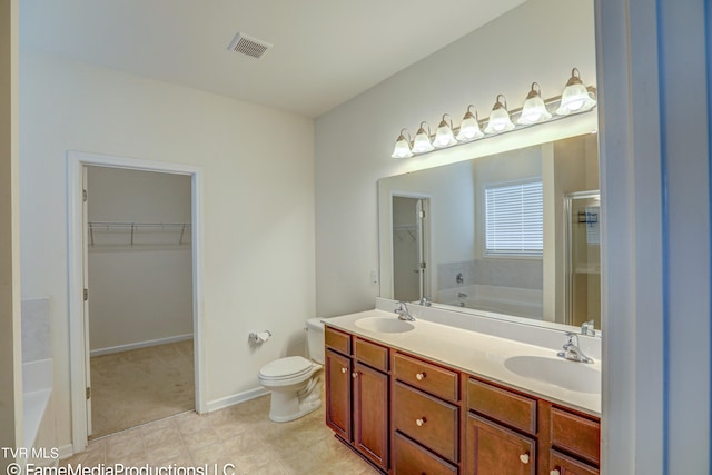 full bathroom with independent shower and bath, vanity, toilet, and tile patterned floors