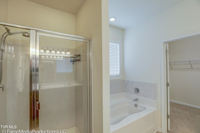 bathroom featuring plus walk in shower