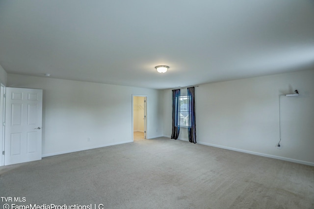 spare room with light colored carpet