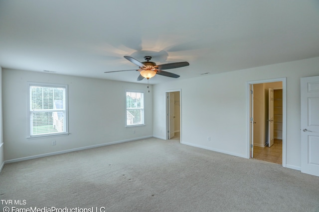 empty room with light carpet and ceiling fan