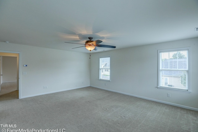 unfurnished room featuring ceiling fan and light colored carpet