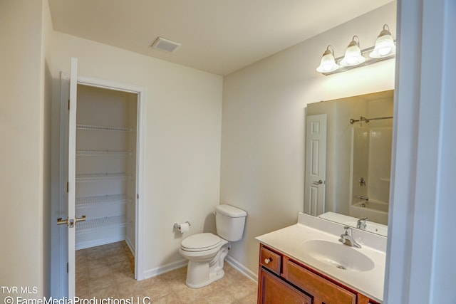 full bathroom with tub / shower combination, tile patterned flooring, vanity, and toilet