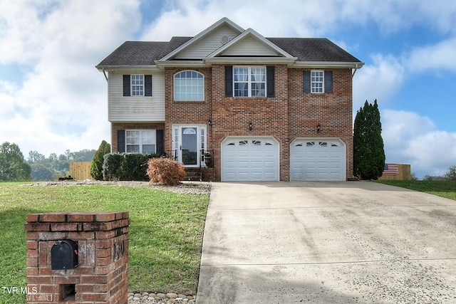 view of front of property with a front yard and a garage