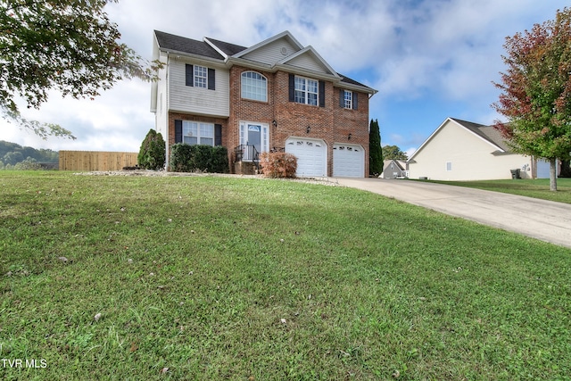 view of front facade with a front yard and a garage